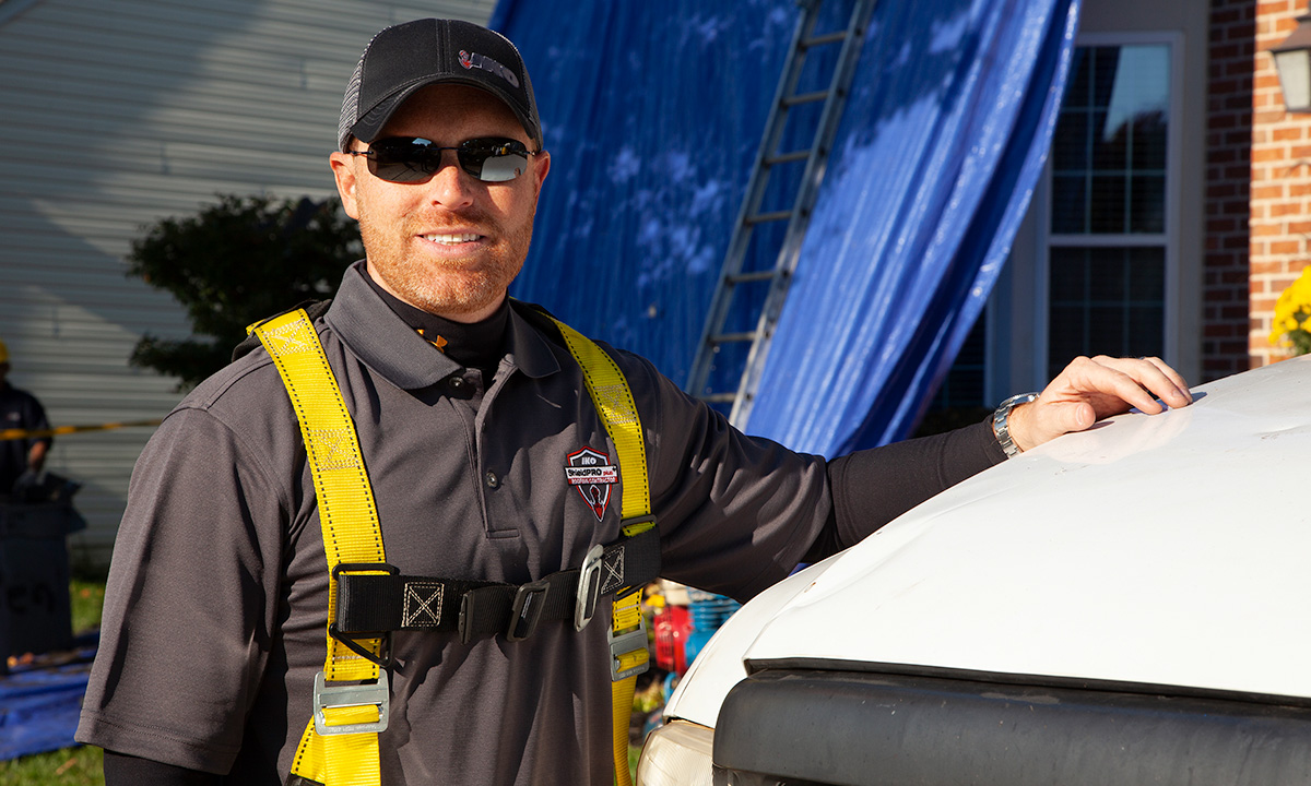 roofer wearing safety harness