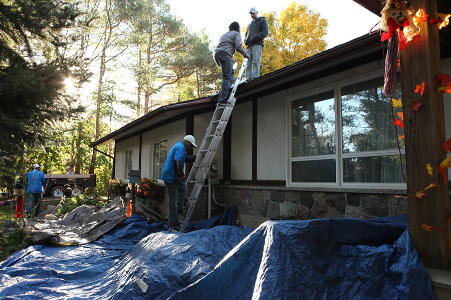 covering shrubbery and flower beds with tarp when doing a roof job