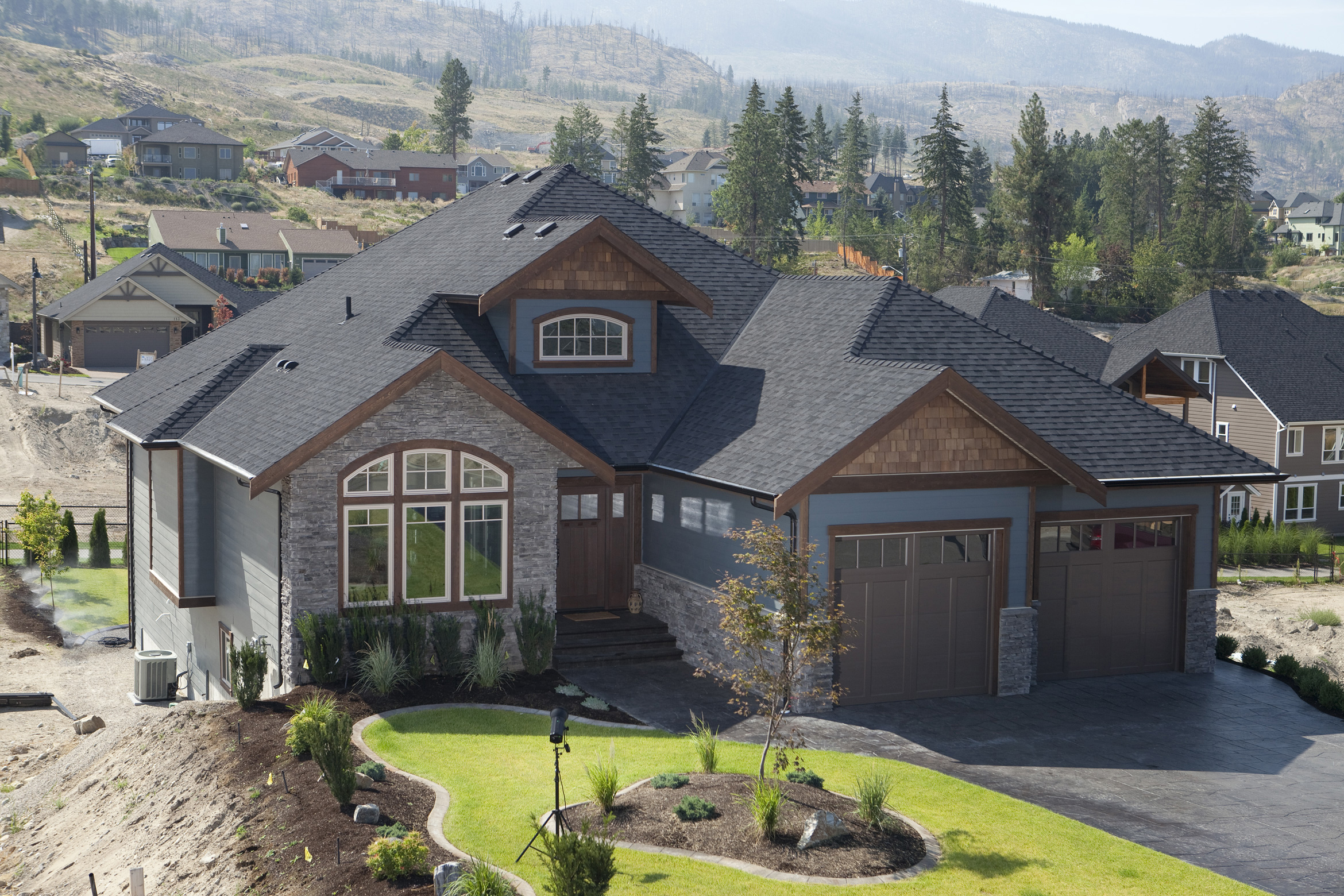 sky blue house color matched to a grey-black roof shingle color