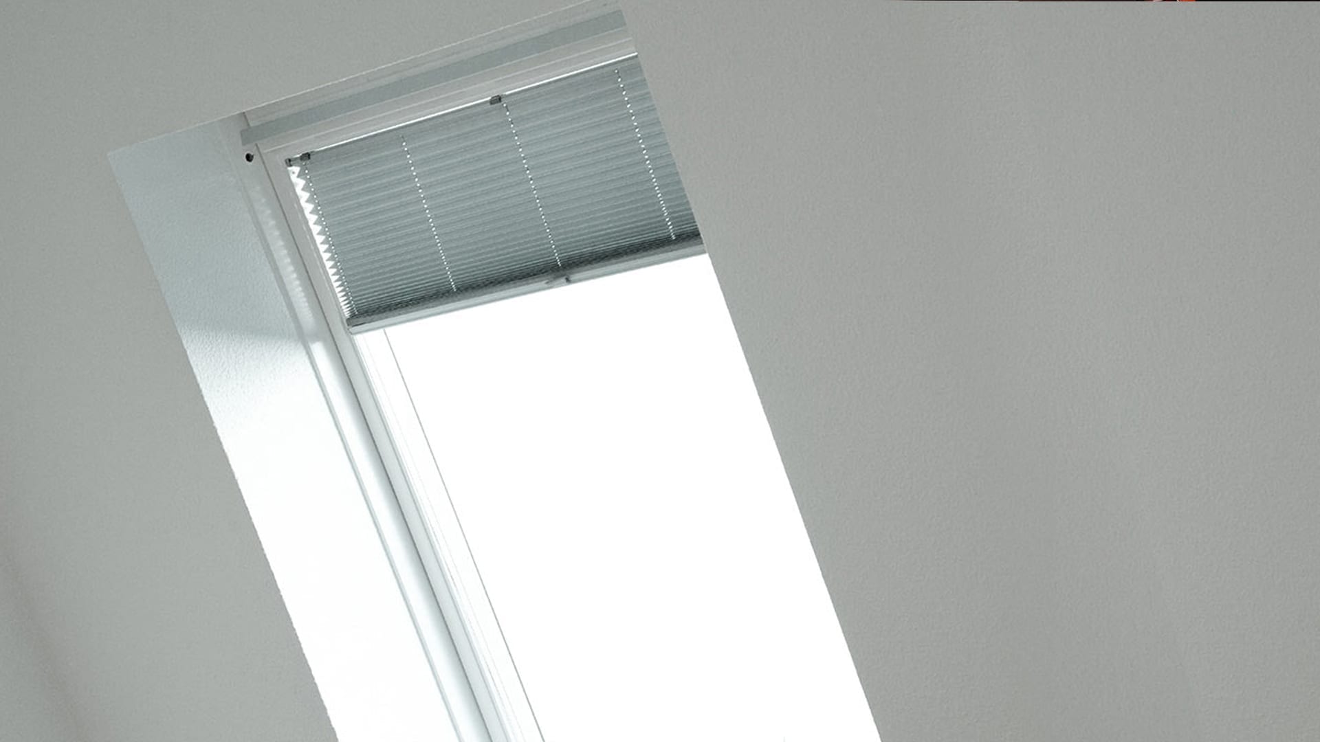 view from inside a home, blinds on a skylight