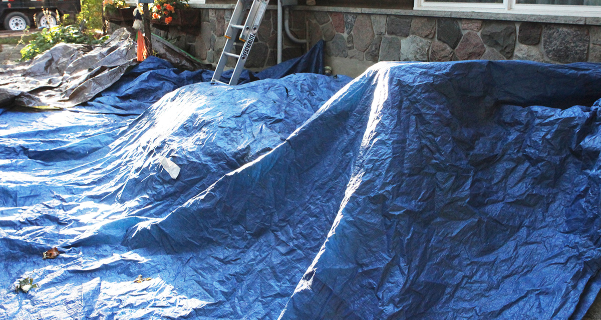 roofing tarps used to protect plants on a roofing job site