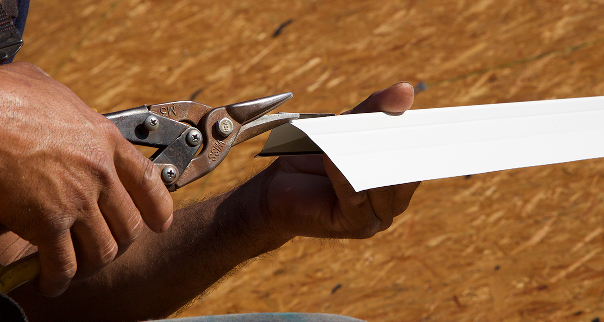 roofing Tin Snips being used to cut drip edge