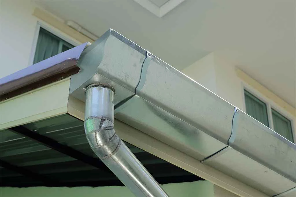 Wrap around gutter hanger