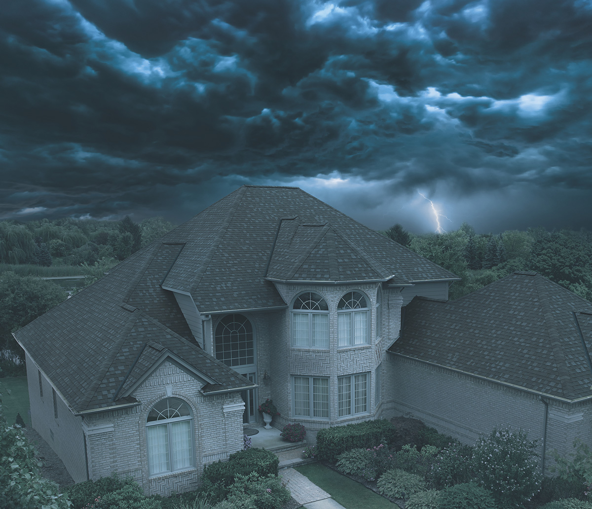 IKO Dynasty Shingles on home - dark clouds above